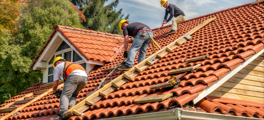 roofing contractors installing clay tile roof on residential home in los angeles Premier Contractor LA